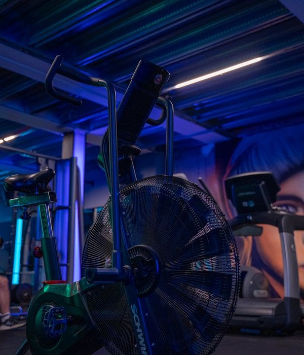 Woman performing a light cardio exercise in a calm studio environment.
